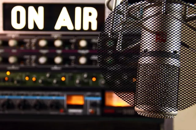 Photo of radio studio with 'on air' sign