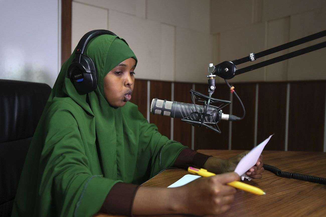 A journalism student practices radio